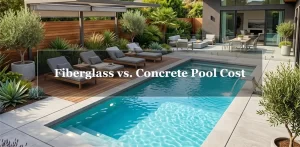 A luxurious modern backyard swimming pool with crystal-clear turquoise water and clean concrete decking, featuring the text overlay "Fiberglass vs. Concrete Pool Cost".